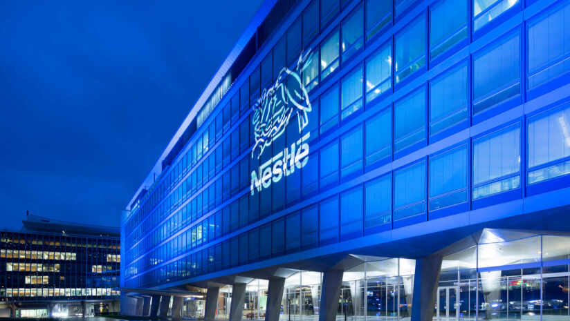 Nestle cuts profit forecast due to weak market conditions and board shake-up.