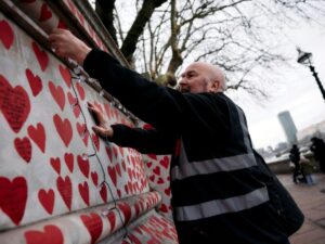 In London, a wall of remembrance for Covid victims lights up for Christmas