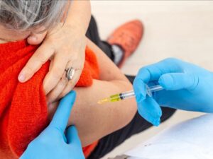 How do COVID-19 vaccines boost cancer treatments?